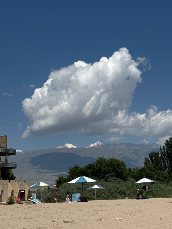 Beach day and boat traffic at Koshkol', Kyrgyzstan