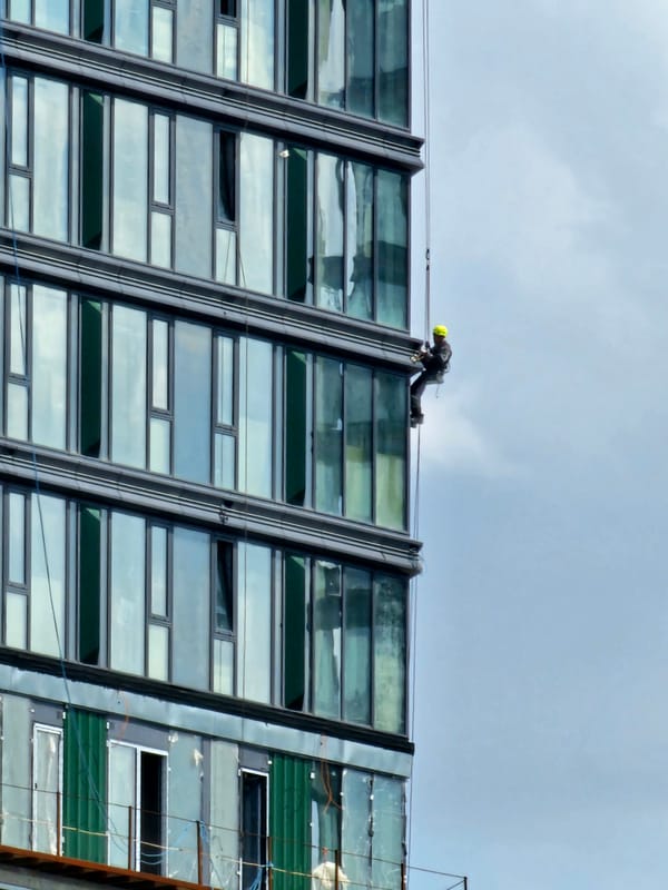 High-rise window cleaning on a Moscow glass tower