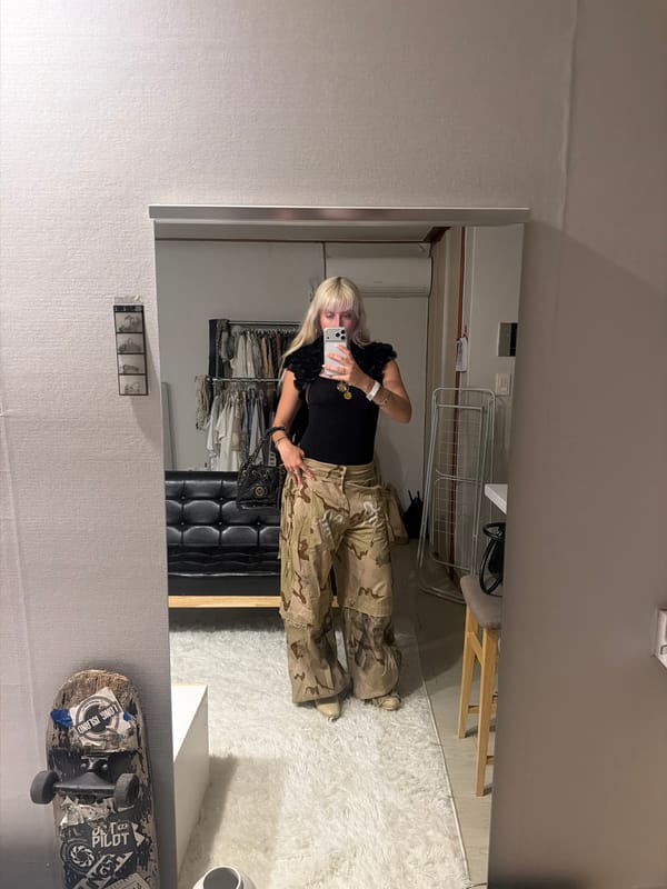 Woman Takes Mirror Selfie in Seoul Bedroom