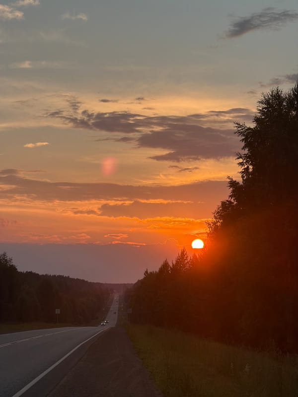 Sunset over forest highway in Chaikovsky, Russia