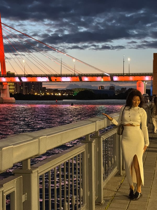 Waterfront evening: lit bridge, sunset views, and city energy