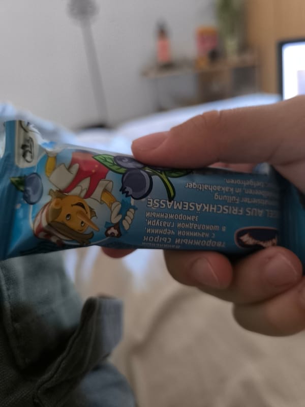 Person enjoys European frozen treat in French bedroom