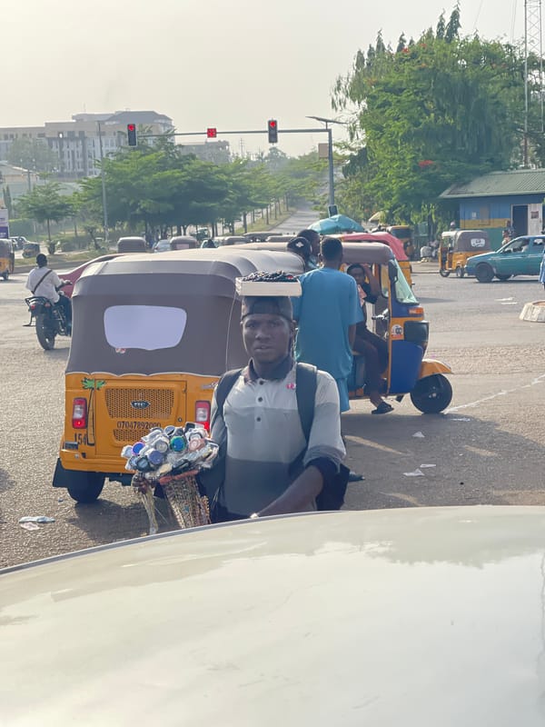 Busy afternoon street life documented across Abuja commercial district