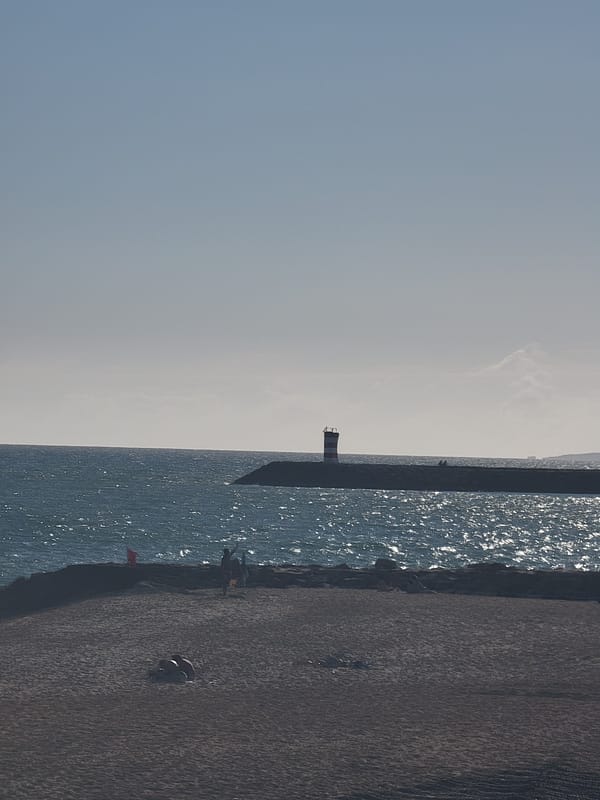 Quarteira beach and promenade on a sunny June afternoon