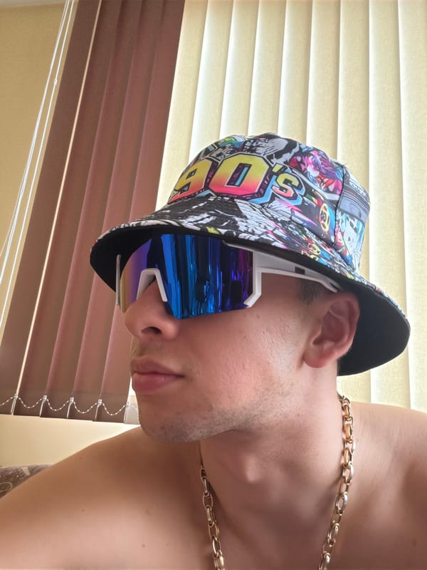 Person in bucket hat photographed indoors, Ford vehicle footage captured