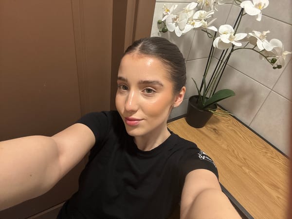 Woman takes selfie in black t-shirt