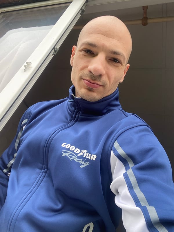Man in Goodyear jacket photographed by window in Pleven