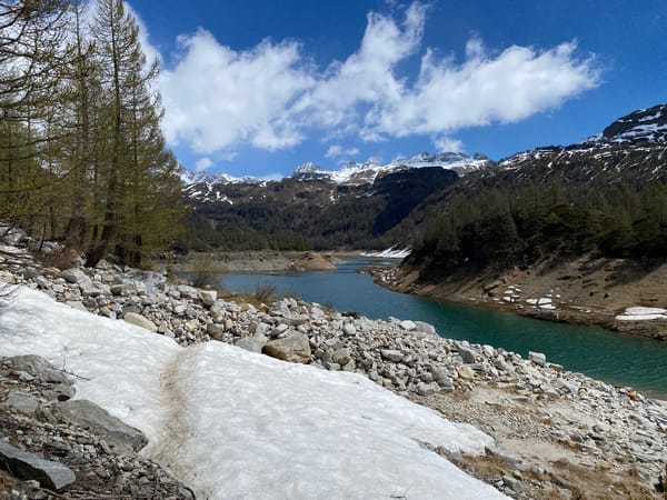 Alpine lake observed amid snow-capped mountains in Baceno, Italy