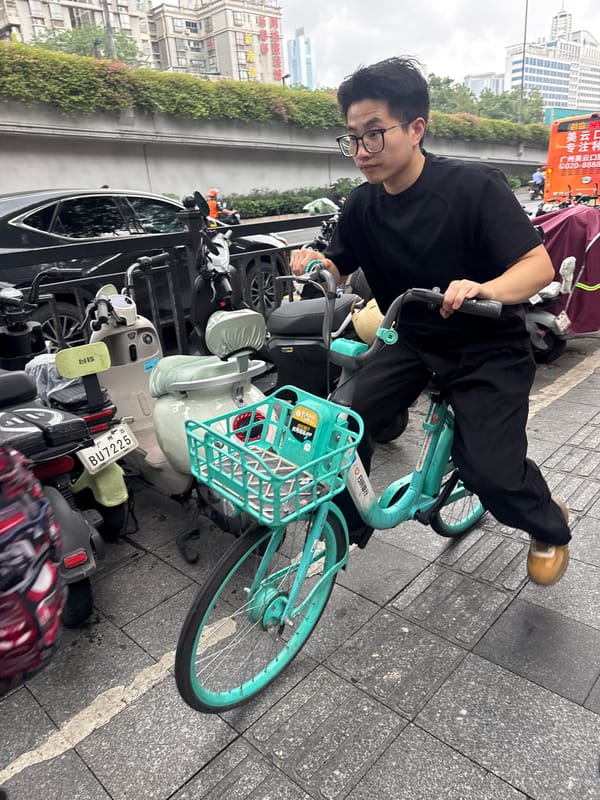 Morning commuters use bikes, scooters in Tianhe District