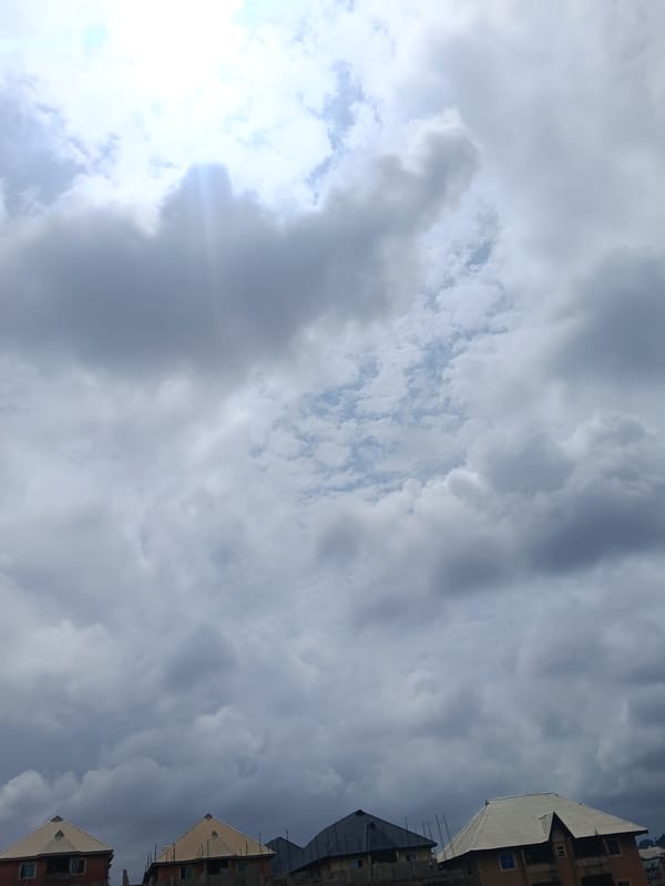 Thick overcast skies settle over Nkpor's rooftops