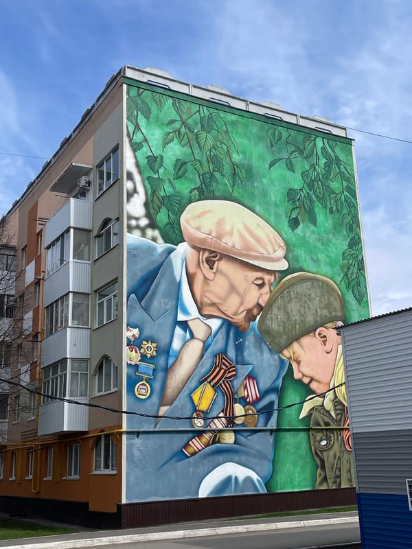 Spring blooms and memorial mural documented in Urussu, Russia