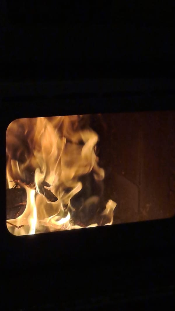 Morning wood fire burns in Bulgarian village stove