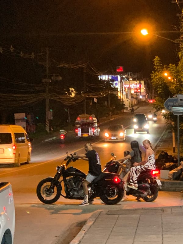Evening street life and floral displays documented in Ko Samui