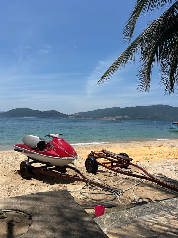 Morning at a Nha Trang beach, jet skis, palms, and small details