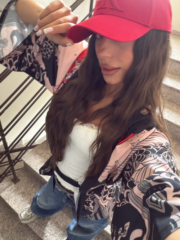 Woman in red cap spends morning with dachshund in Varna