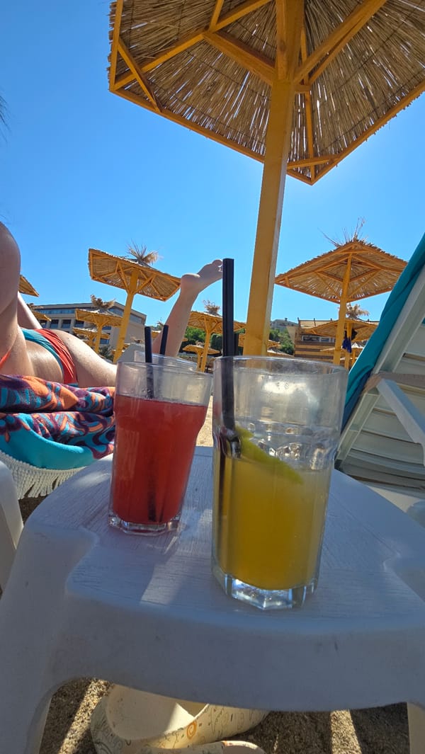 Drinks, selfies, and sunglasses reflections at a sunny beach