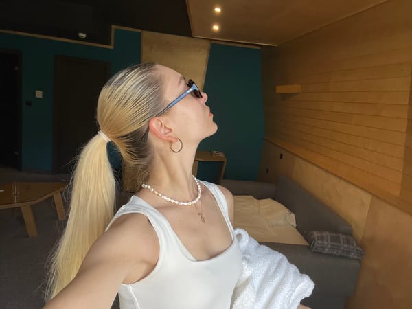 Woman takes multiple hotel room selfies during morning routine