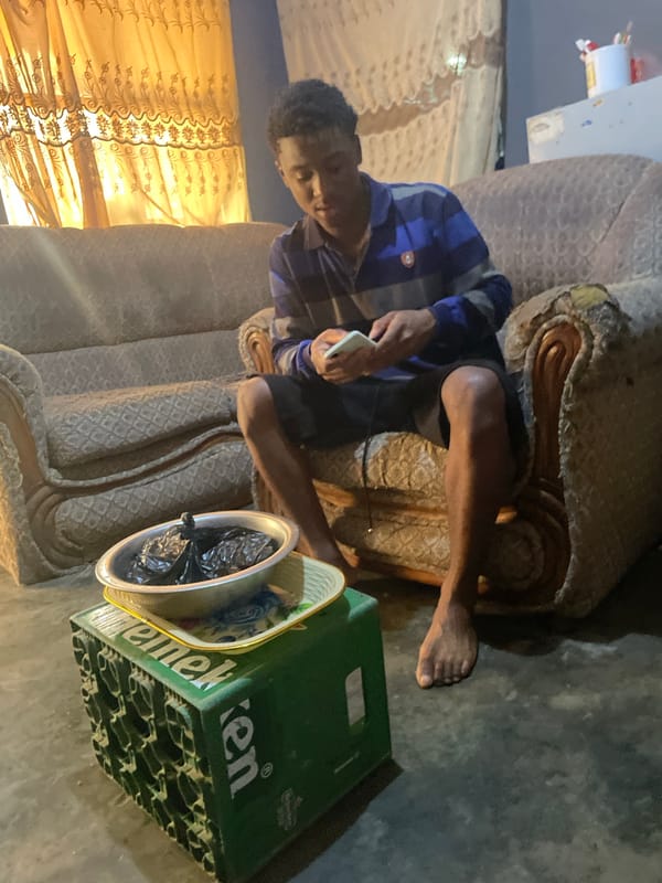 Morning scenes from Jos: phone user, indoor woman, rickshaw