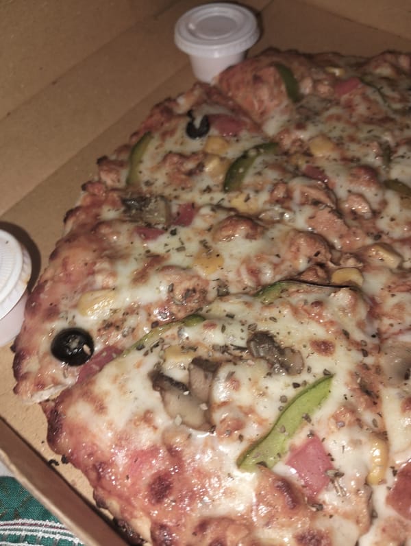 Pizza delivery documented by witnesses in Dhaka