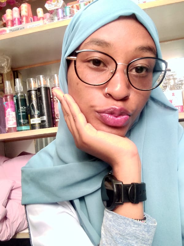 Woman photographed in perfume shop in Nyeri, Kenya