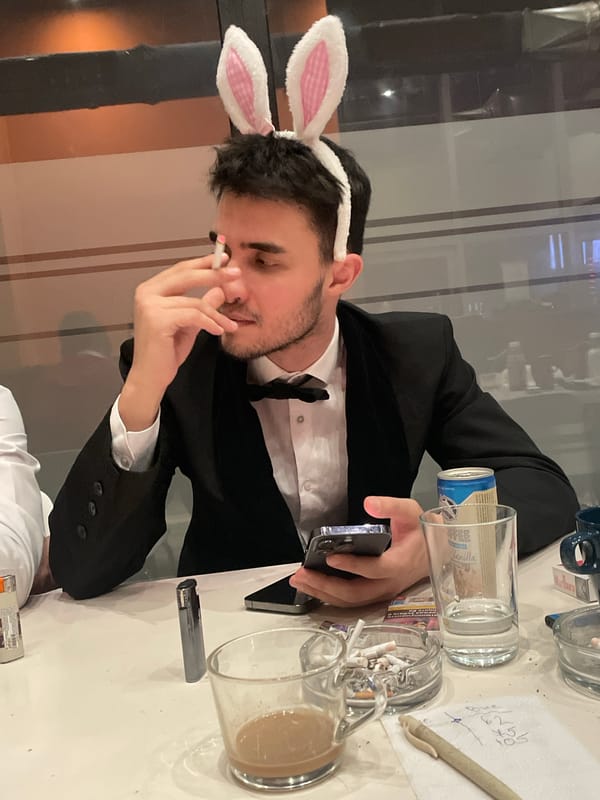 Man in black suit observed at indoor table in Sofia