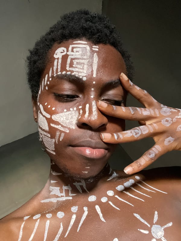 Artistic portrait with white body paint captured in Onitsha