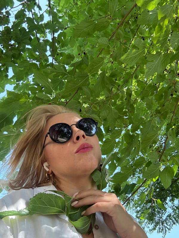 A Sochi park morning: scooters, greenery, and casual outdoor activity