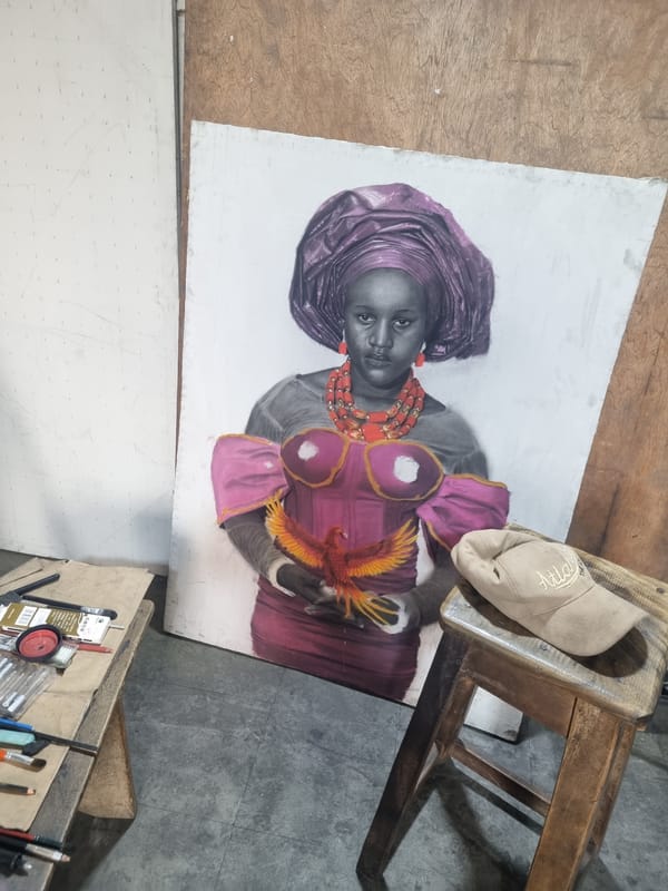 Artist works on portrait while observer watches painting session