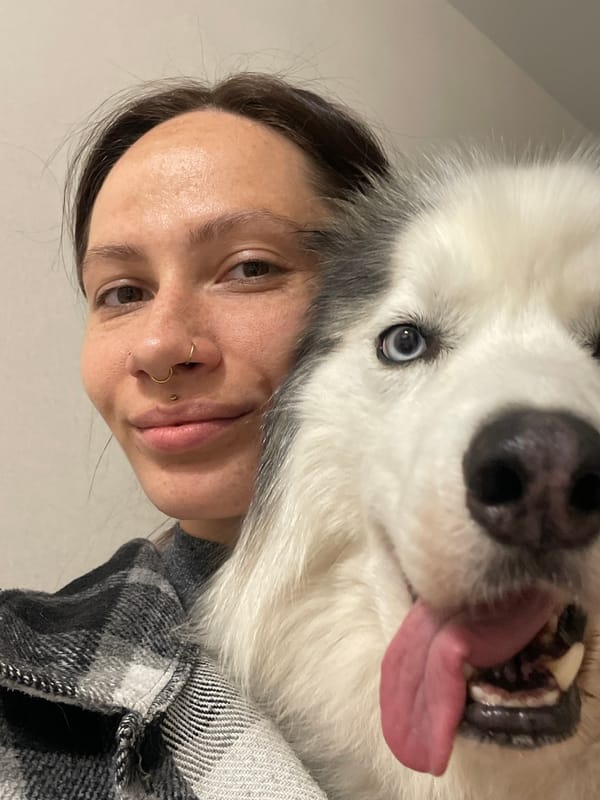 Woman photographs with Siberian Huskies across Russian cities