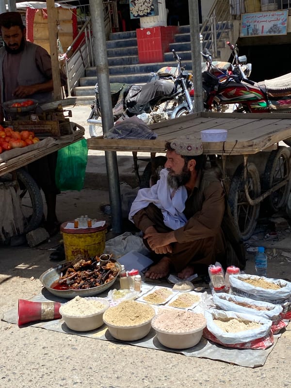 Street market activity near Kandahar's Great Mosque