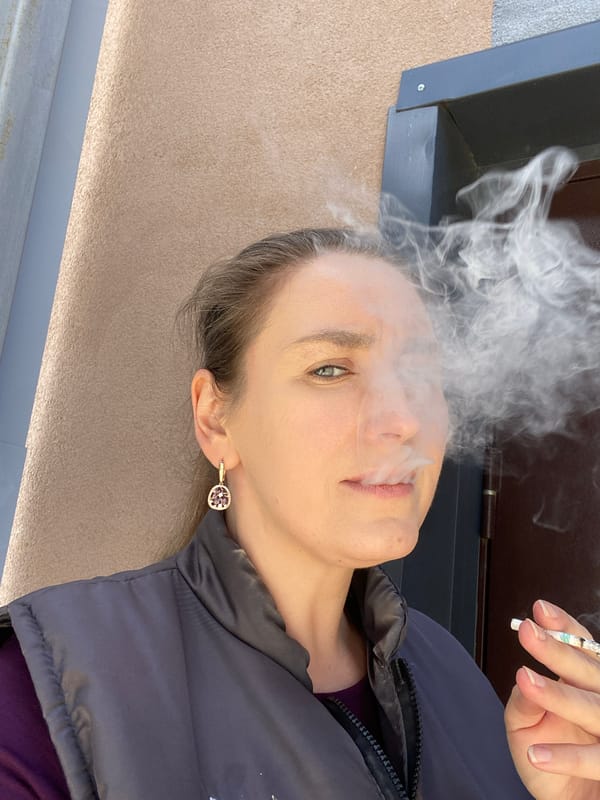 Woman smoking, flowers photographed in early morning Yekaterinburg session