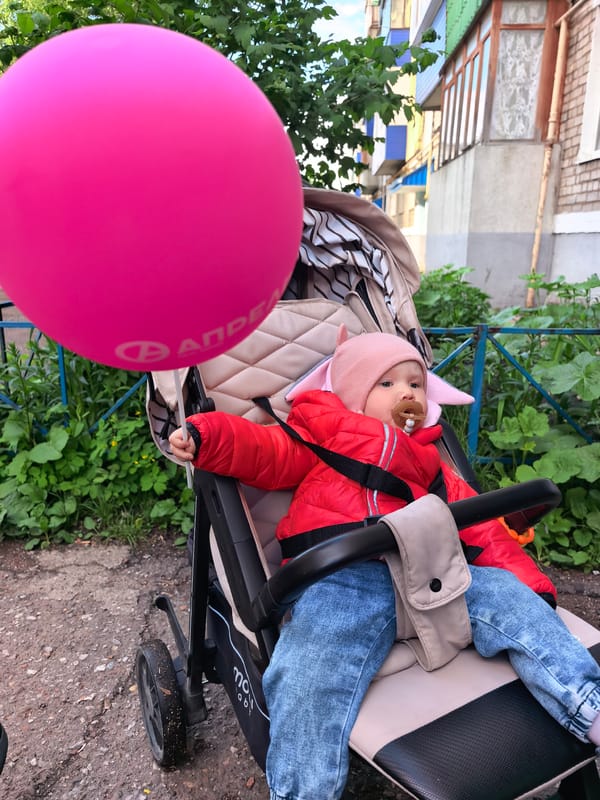 Afternoon neighborhood walk with dog and baby in Sterlitamak
