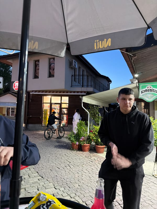 Evening cafe culture captured on Panagyurishte cobblestone streets