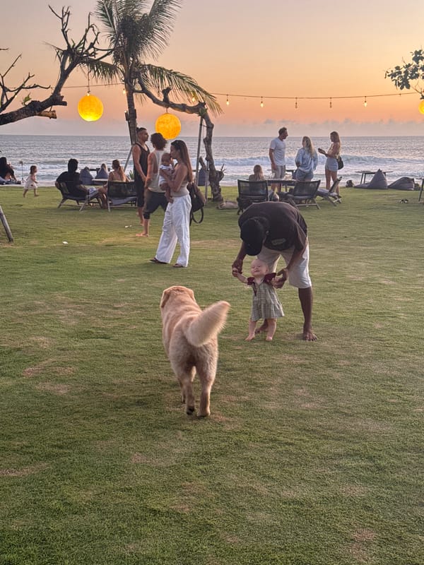 Tropical sunset and baby on grass documented in Indonesia