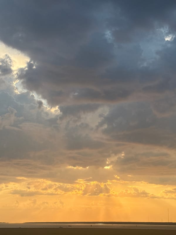Storm clouds and golden light clash over the Gulf of Finland