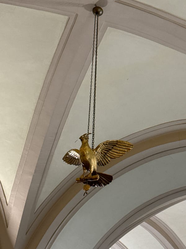 Ornate Saint Petersburg interior with frescoed ceiling and gilded bird