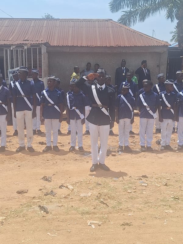 Uniformed group holds ceremony with flags in Sabon Tasha