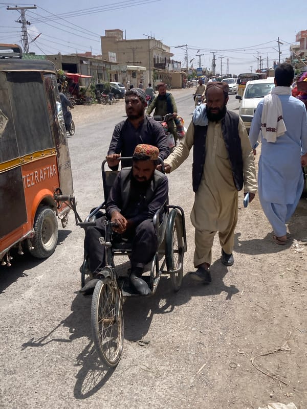 Elderly cyclist spotted on busy Loralai street during sunny afternoon