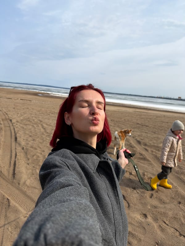 Woman walks dog, takes selfie on icy Russian beach