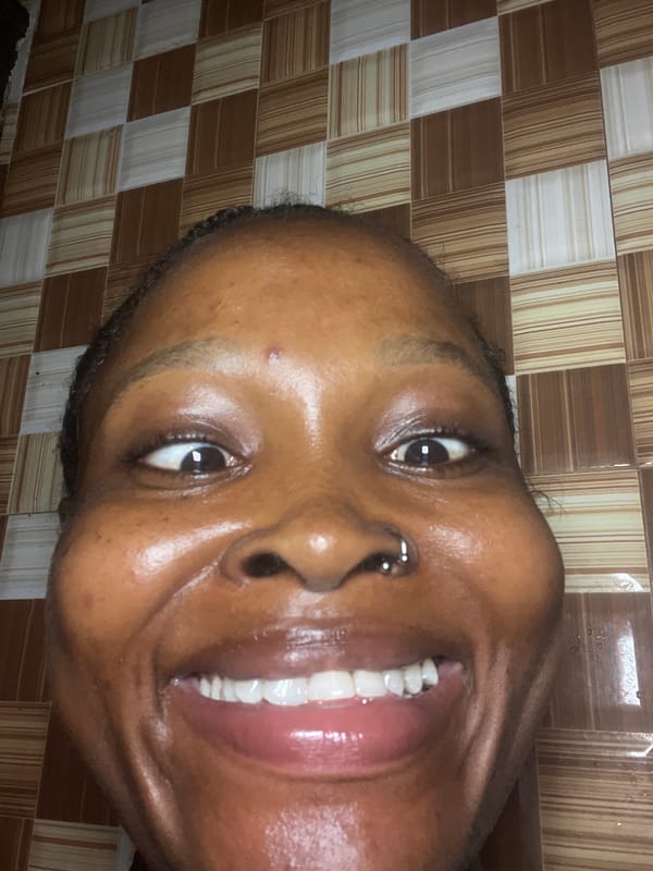 Bathroom selfie session with playful props in Ado, Nigeria