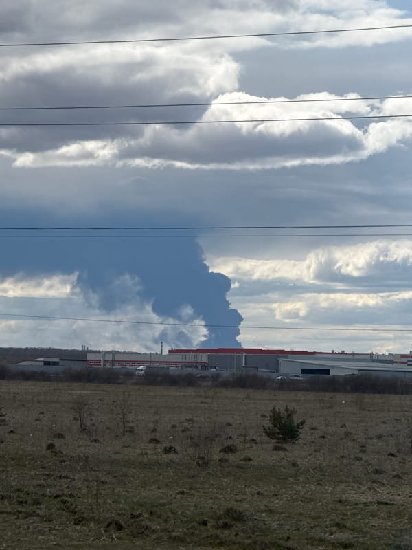 Dramatic cloudy skies photographed over Zamulyanka industrial-rural landscape