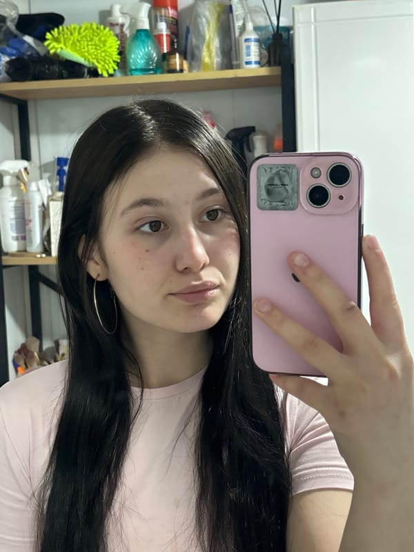 Woman takes playful selfies with cat in Russian home