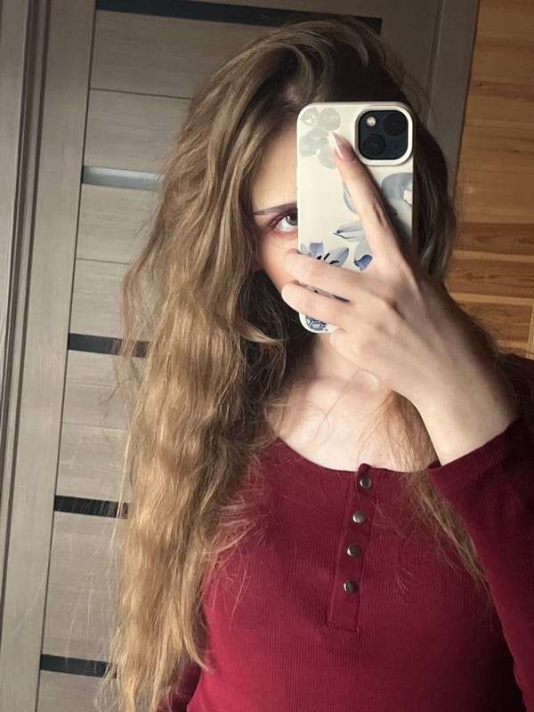 Woman takes morning selfies in Ashkadar, Russia