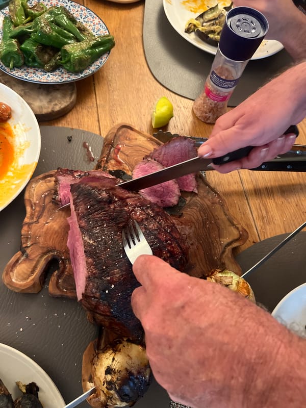 Dinner gathering with meat carving captured in Petah Tikva