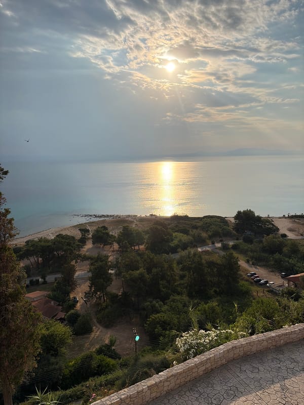 Aerial golden hour views over Kassandra's calm turquoise coast