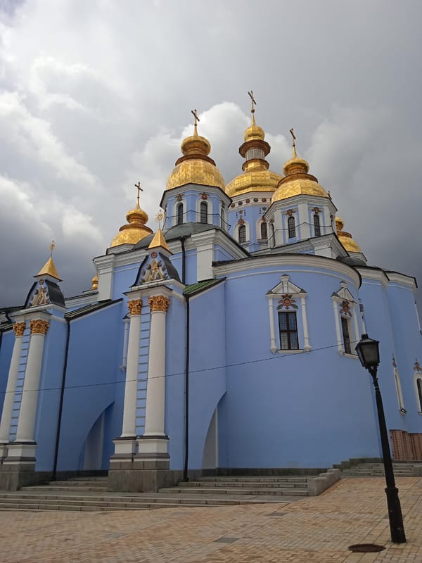 Kyiv landmarks, churches, and riverfront on a July morning