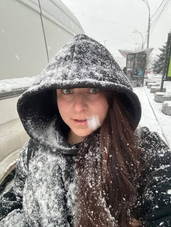 Woman photographed in snowy conditions in Kyiv