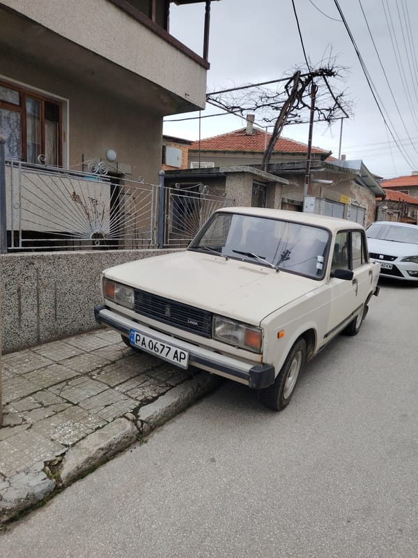 Car parked on sidewalk in Panagyurishte residential area