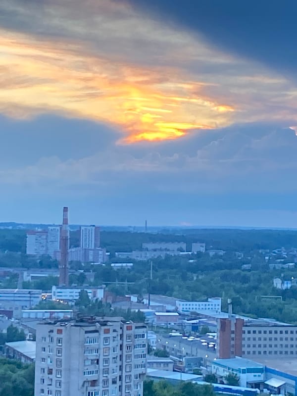 Woman documents sunset selfie session across Izhevsk, Russia