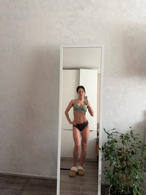 Woman takes mirror selfie in Perm residential setting